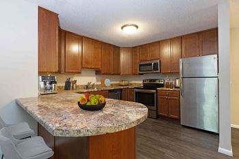 Updated kitchen & bathrooms with granite countertops*